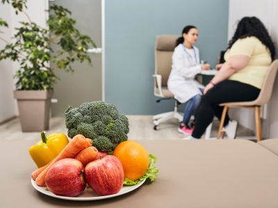 Healthy diet. Dietitian plans meal plan and diet to weight loss for a female obese patient Healthy diet. Dietitian plans meal plan and diet to weight loss for a female obese patient