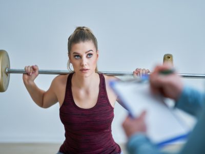 Woman with her personal fitness trainer Woman with her personal fitness trainer